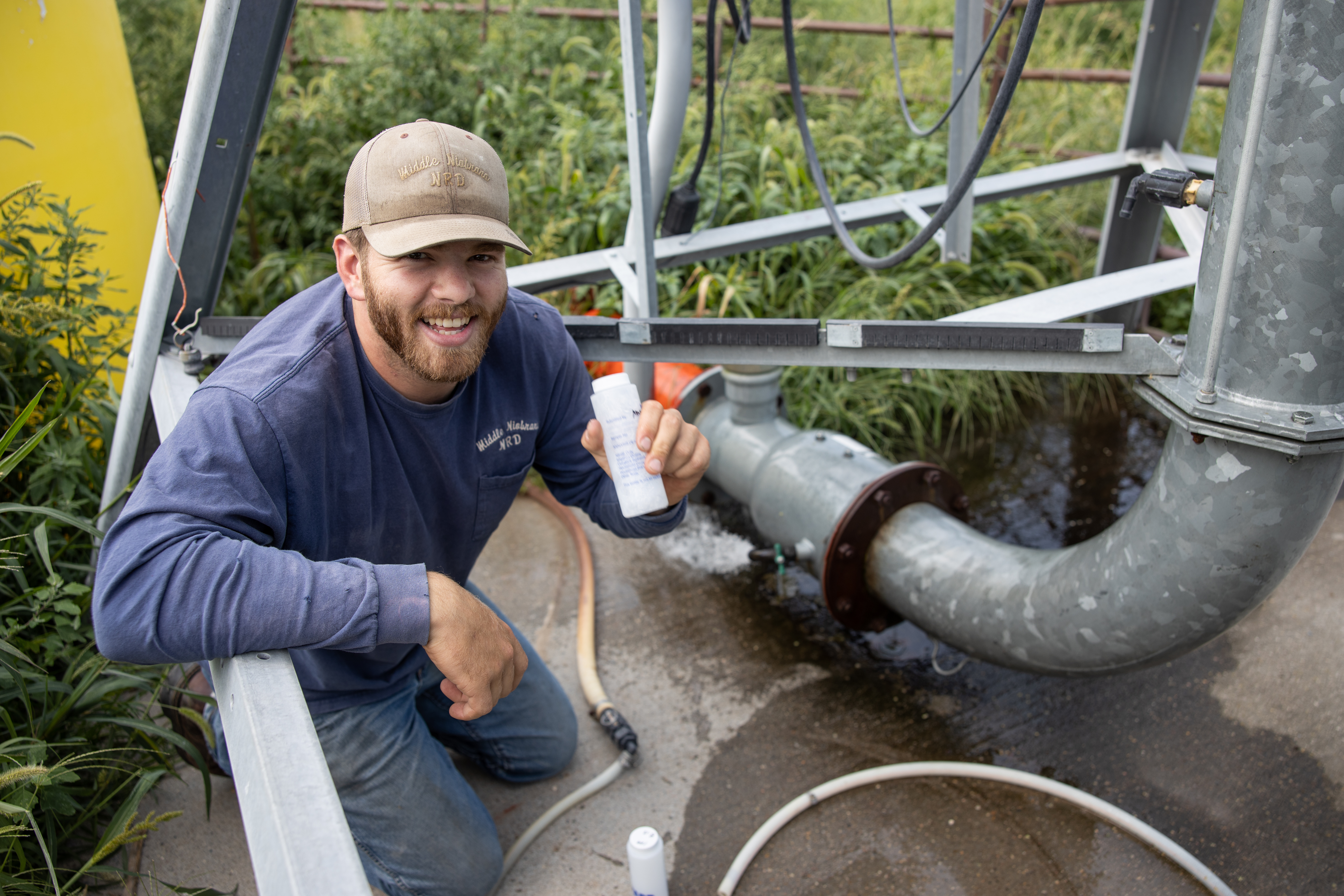 Kyle collecting a water sample