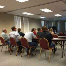 Group of people watching a presentation