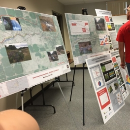 People viewing project maps and photos