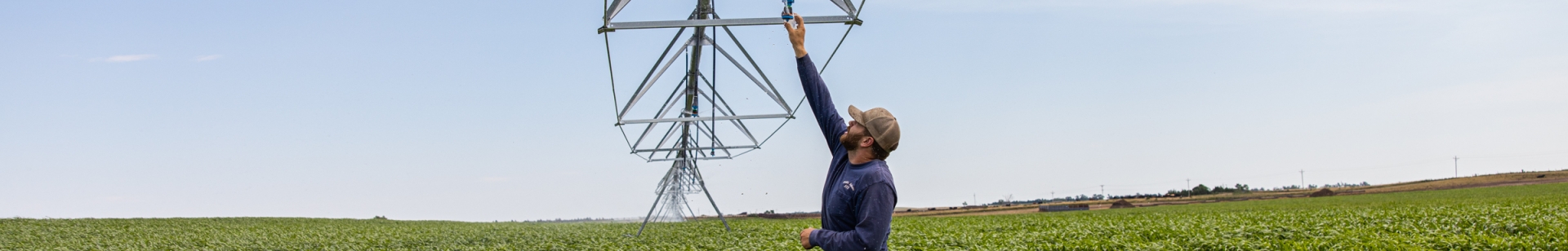 Collecting a water sample from an irrigation pivot