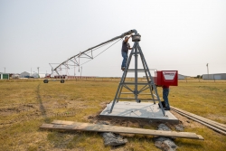 Technicians finishing installing the irrigation pivot