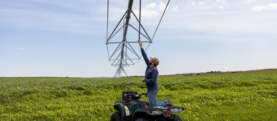 Collecting a water sample from an irrigation pivot